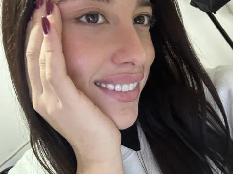 A close-up of Natalye smiling